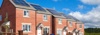 Line of attached houses with solar panels