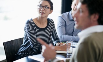 People engaged in discussion in a meeting