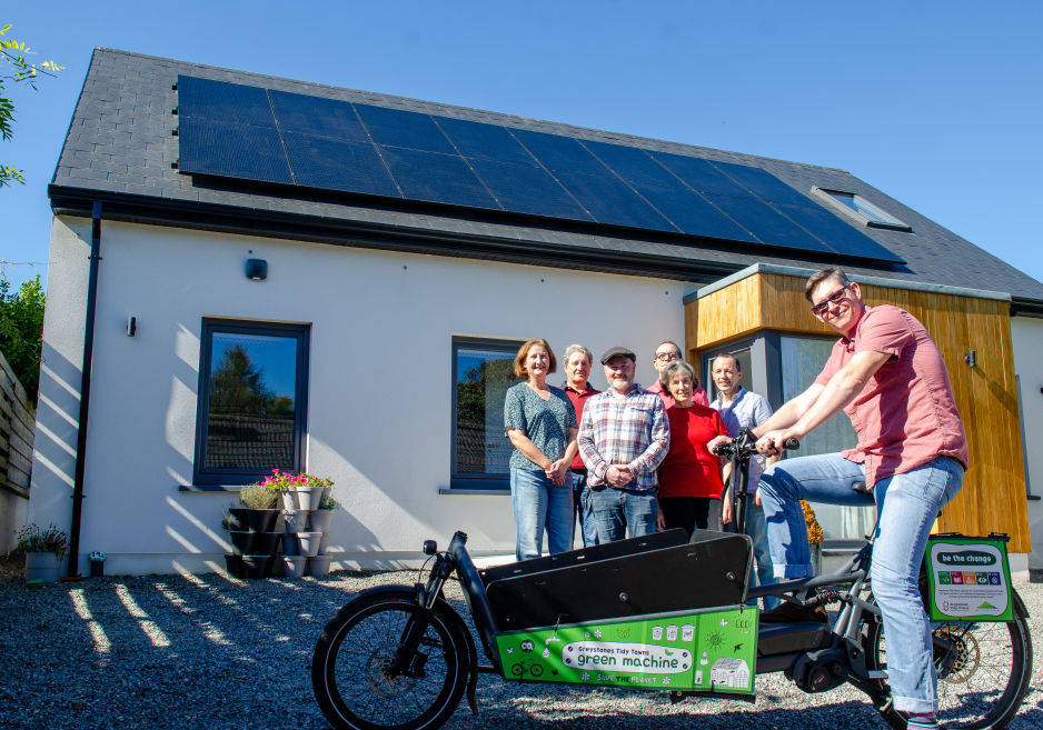 Family outside house with solar pv