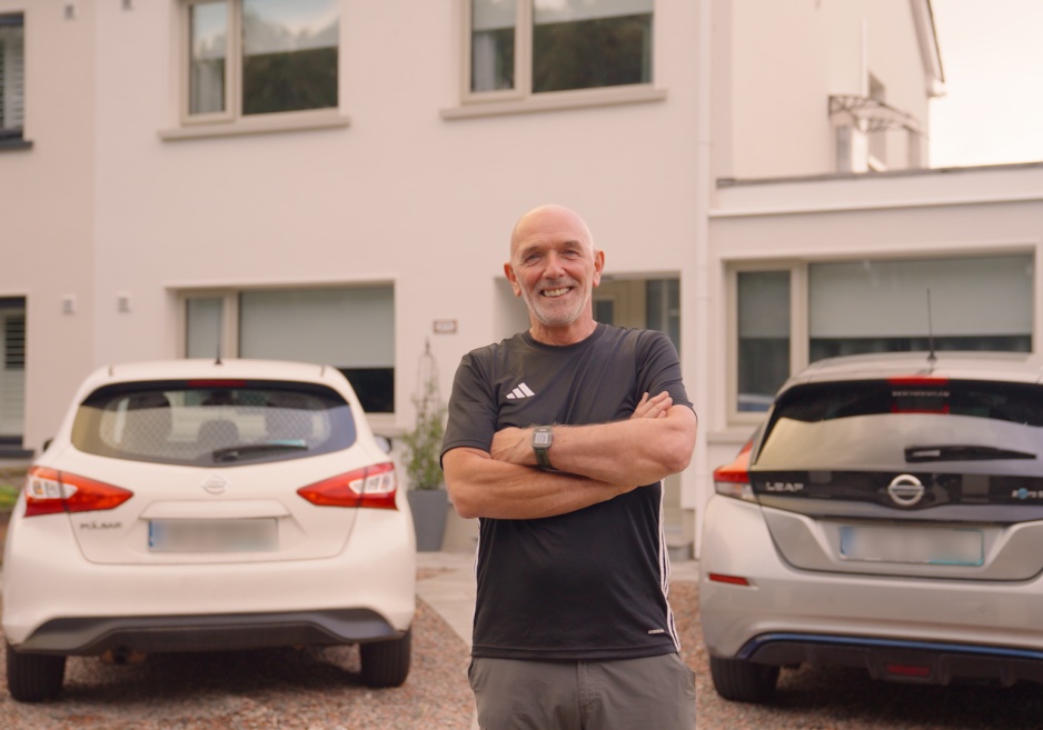 John Brady, a homeowner, standing outside his recently upgraded home.