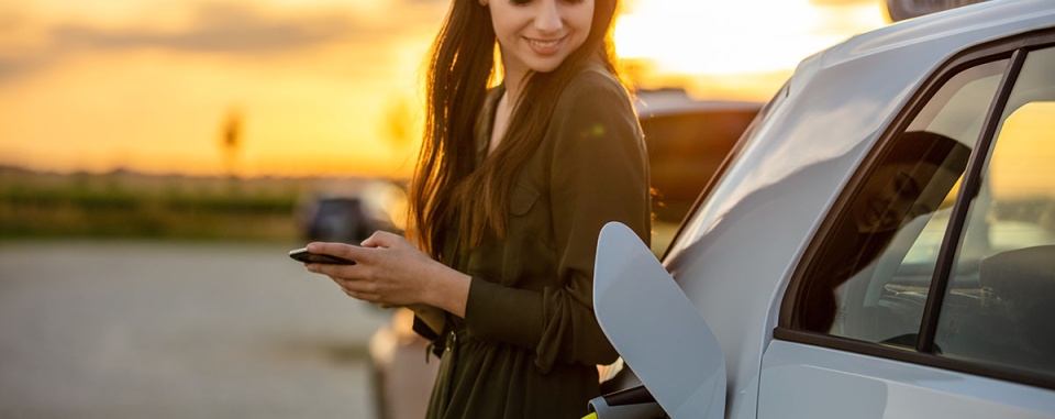 picture of girl charging her electric vehicle