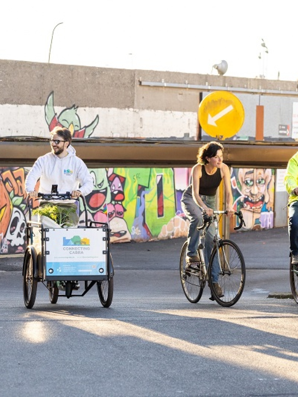 Four people riding bikes