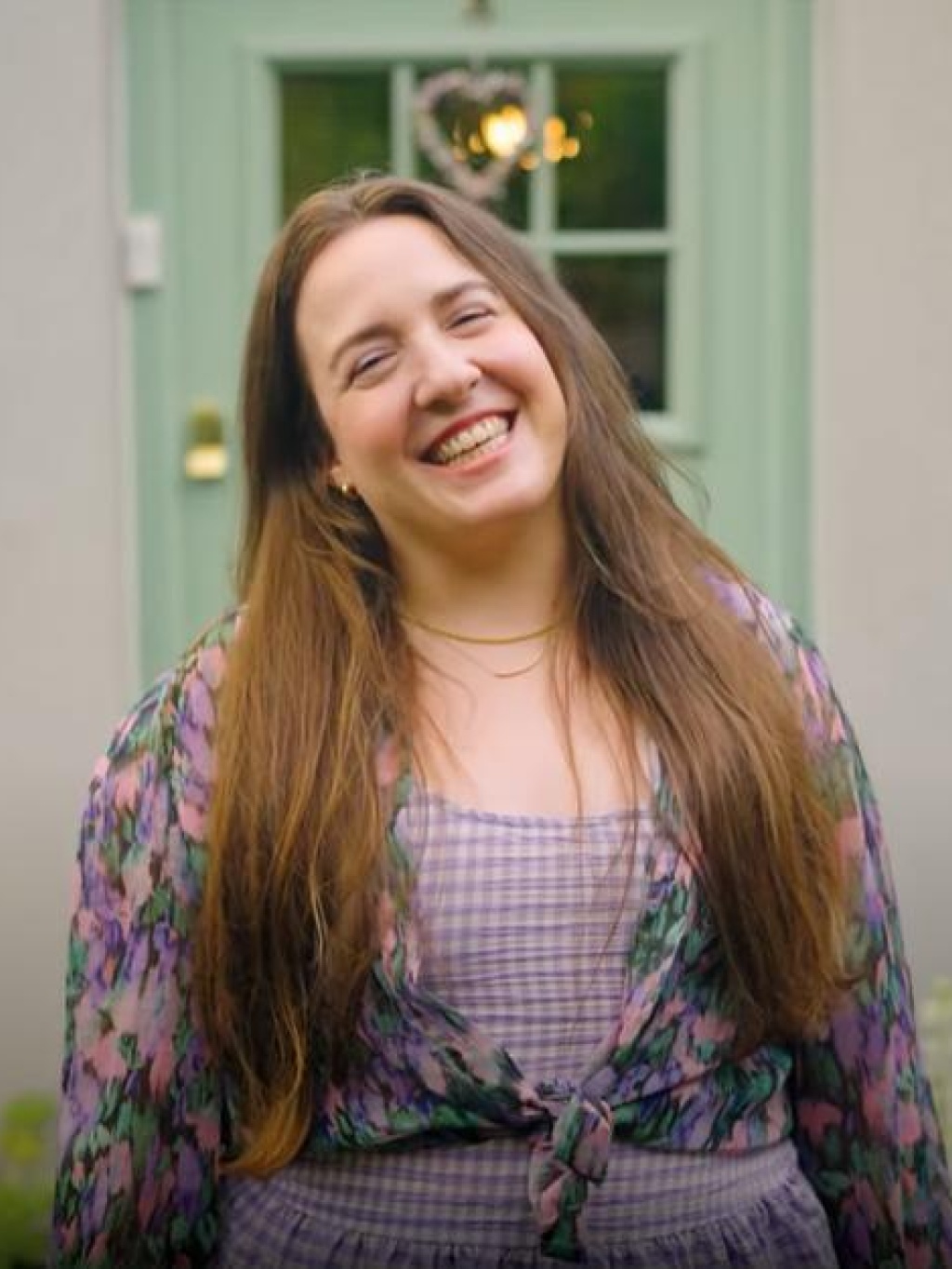 Ellie, a homeowner, outside her newly upgraded house
