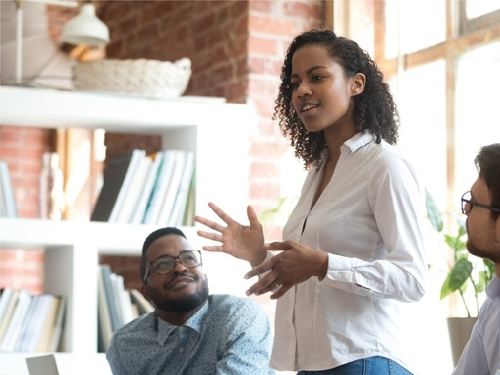 a woman presenting in a meeting